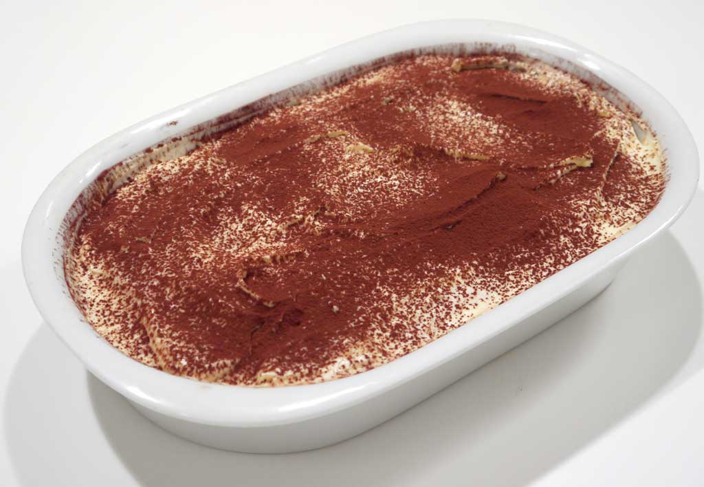 A whole Tiramisu in a serving tray
